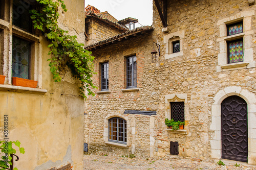 Fototapeta Naklejka Na Ścianę i Meble -  Close view of the authentic stone house of Perouges, France, a medieval walled town, a popular touristic attraction.