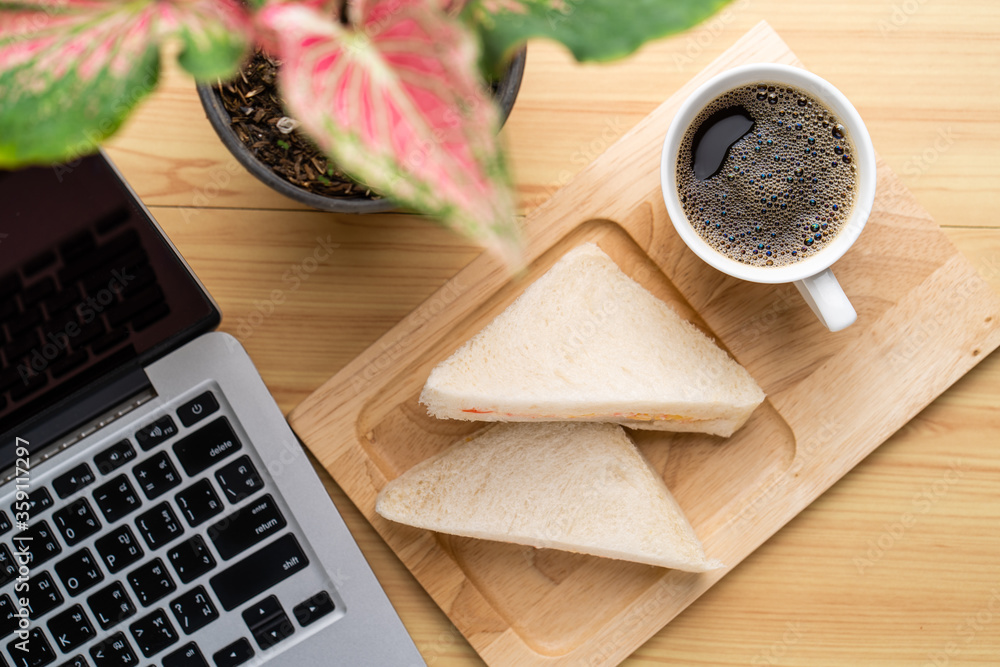 Cup coffee and Crab sandwich for break on working desk Cup coffee and Crab sandwich for break on working desk