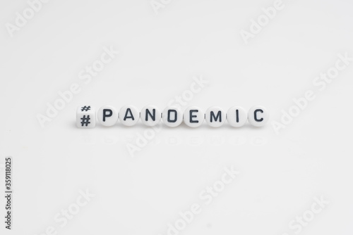 The word pandemic in small alphabetical beads, isolated over white