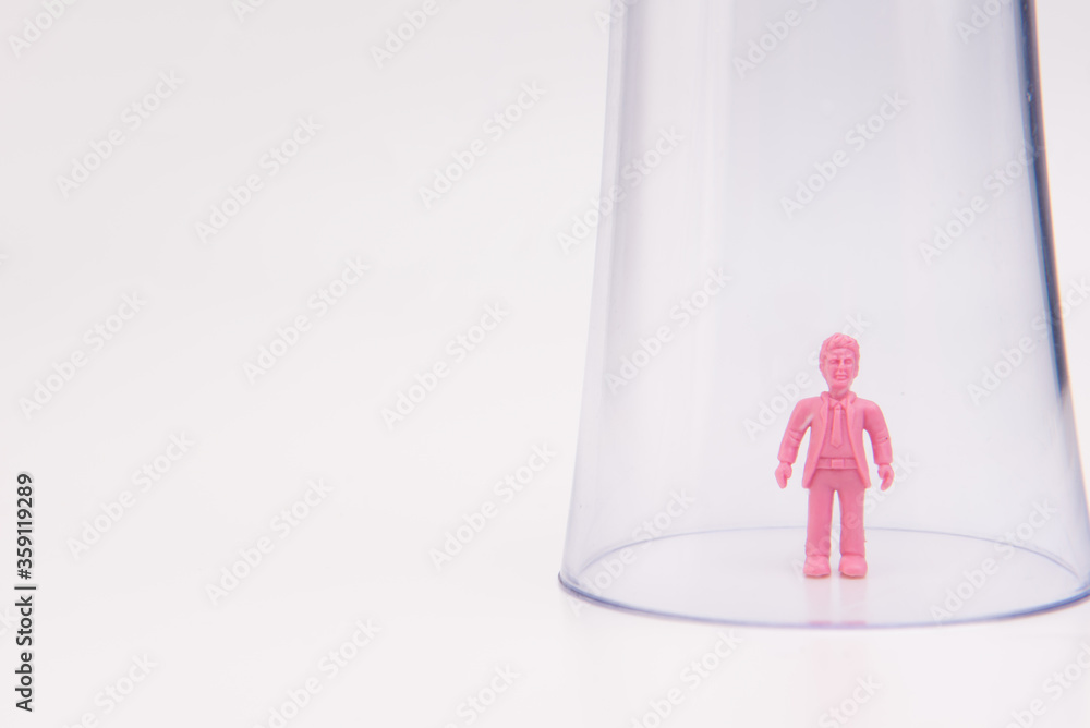 Obraz premium A toy inside a glass isolated over white background