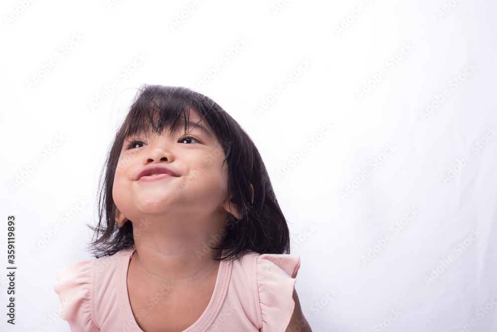 An asian child, with black hair wearing pink dress,showing various expression An asian child, with black hair wearing pink dress,showing various expression