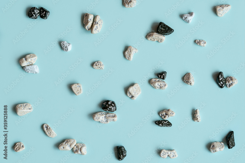 Concept we are all different. All life matter. Сolorful stone, texture on the blue background. Stop racism, black and white. Concept we are all different. All life matter. Сolorful stone, texture on the blue background. Stop racism, black and white.