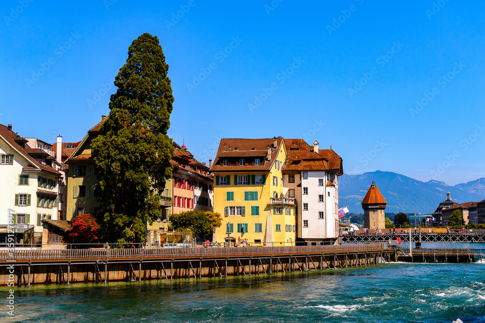 Typical architecture on the river Reuss in Lucerne, a city in the German-speaking part of Switzerland