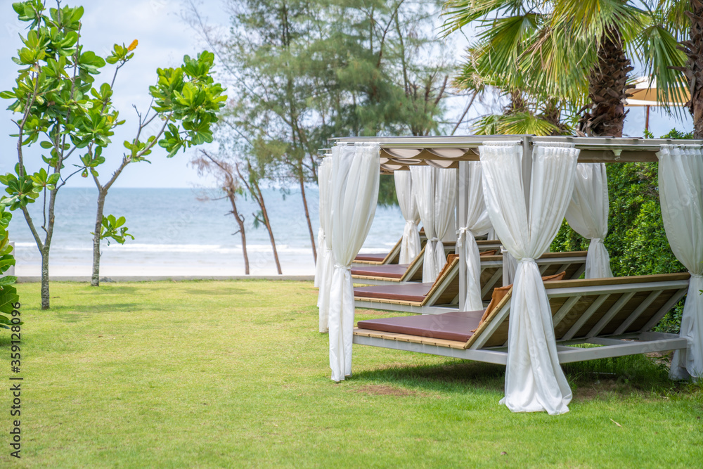 Relaxing square pavillon in the line on direction to the beach and sea in cozy tropical environment at Asia beach. Relaxing square pavillon in the line on direction to the beach and sea in cozy tropical environment at Asia beach.