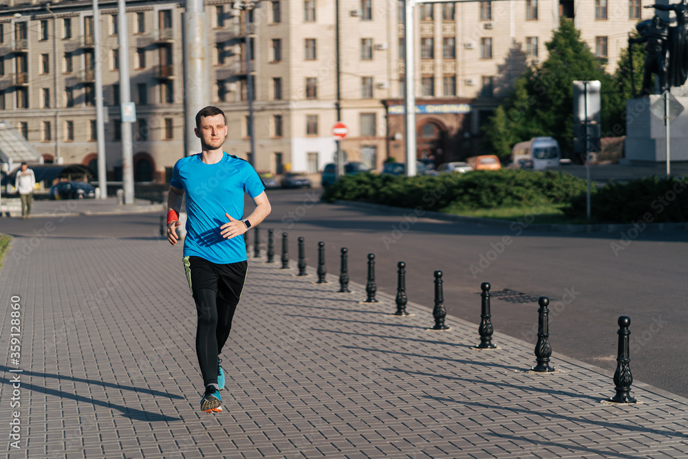Man running in the city. Fitness workout, sport lifestyle concept. Man running in the city. Fitness workout, sport lifestyle concept.