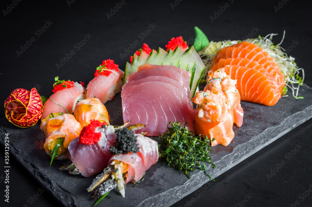 OKAMI Japanese Restaurant - Try the Sushi & Sashimi Platter! Rich  assortments of traditional Japanese sushi rolls, nigiris and sashimi. #okami  #okamirestaurant #sashimi #sushi #sushi #nigiri #teriyakichickenroll  #cookedtunaroll #tempuraprawnroll