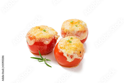 Tomatoes stuffed with rice and vegetables, baked with cheese . Vegetarian food. isolated on white background