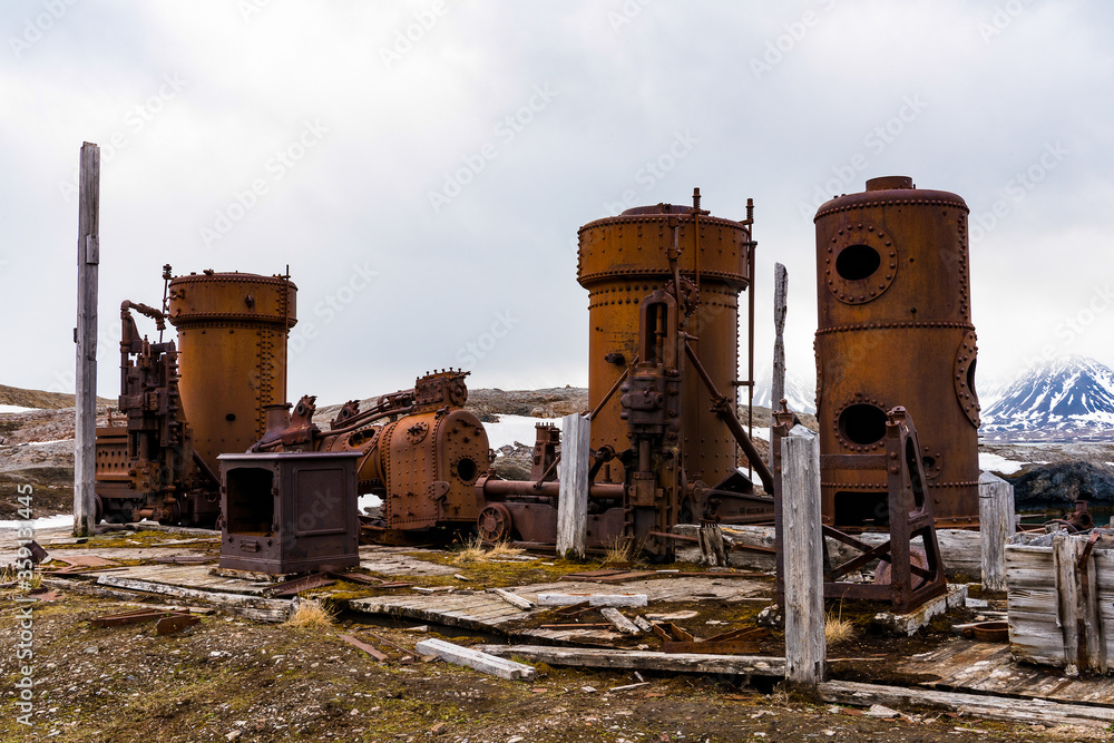 Fototapeta premium Broken Mining equipment in the New London settlement, Svalbard archipelago