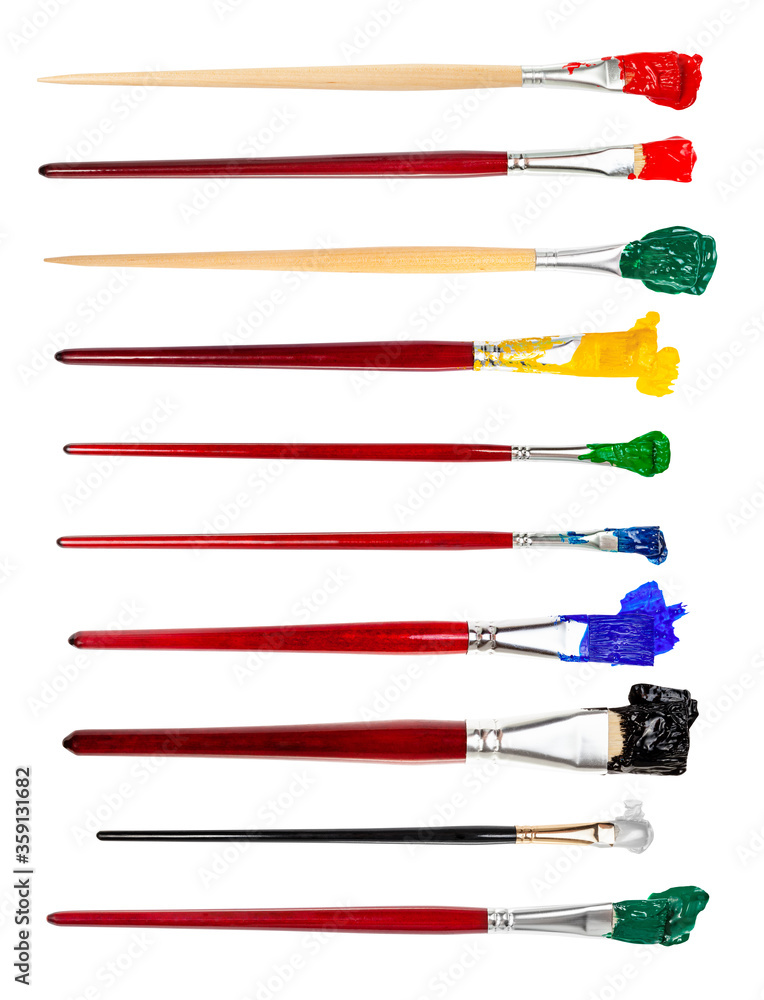 set of flat paint brushes with various colored tips in blots isolated on white background set of flat paint brushes with various colored tips in blots isolated on white background