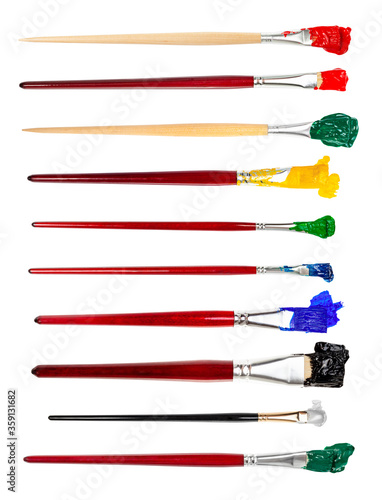 set of flat paint brushes with various colored tips in blots isolated on white background