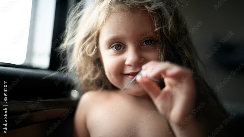 Portrait of a girl with loose hair and looking into the camera Portrait of a girl with loose hair and looking into the camera