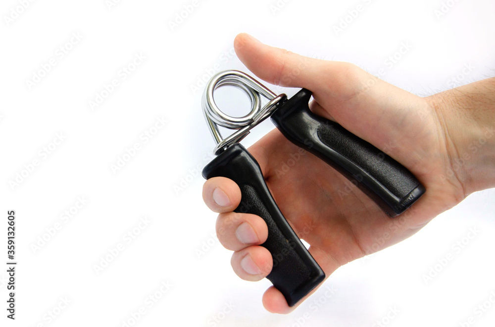 Expander finger trainer, finger workout tool on a white background close up.