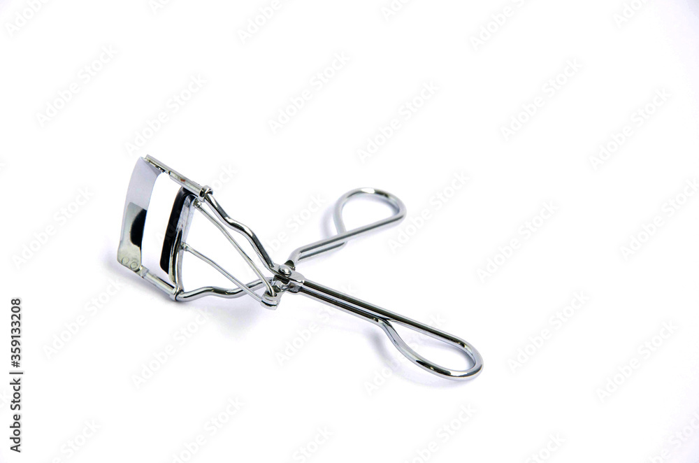 Eyelash curler, eyelash curler close up on a white background. Eyelash curler, eyelash curler close up on a white background.