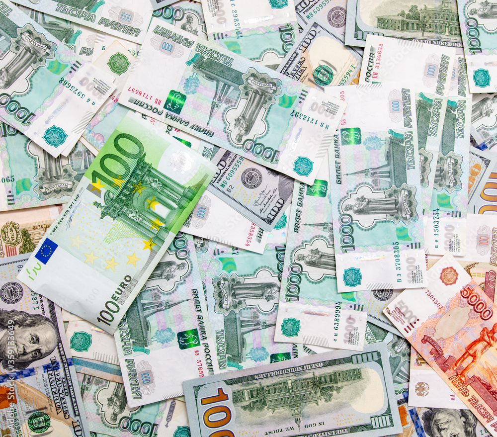 Dollars and Russian rubles. Euro on the table as background Dollars and Russian rubles. Euro on the table as background