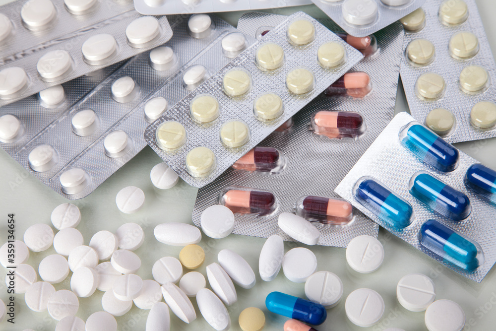 Lots of different medicine: pills, tablets, capsules, pills in blister pack, medications drugs. Macro, selective focus, copy space Lots of different medicine: pills, tablets, capsules, pills in blister pack, medications drugs. Macro, selective focus, copy space