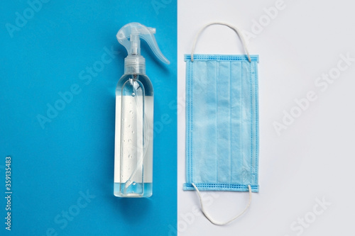 Hand sanitizer with a surgical mask. Hygienic disinfection. Surgical protective mask. Concept of Covid-19 quarantine. USA epidemic outbreak. Coronavirus pandem. antiseptic skin treatment photo
