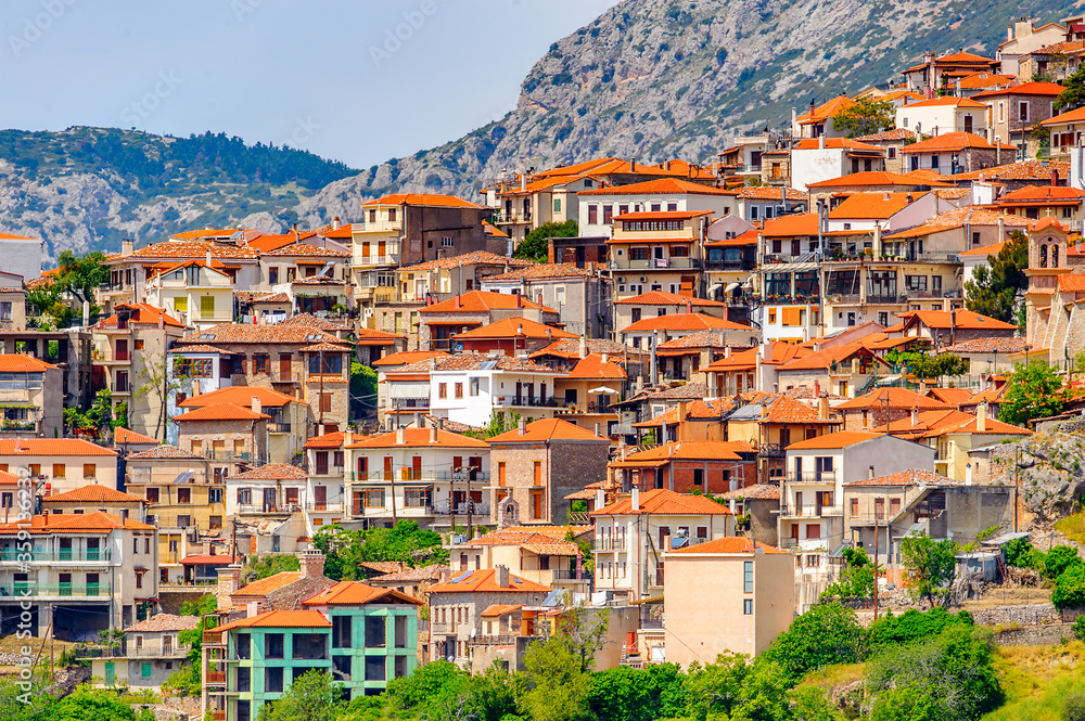 It's Houses of Arachova, Greece. A village on the green slopes of Parnassus Mountains, Greece