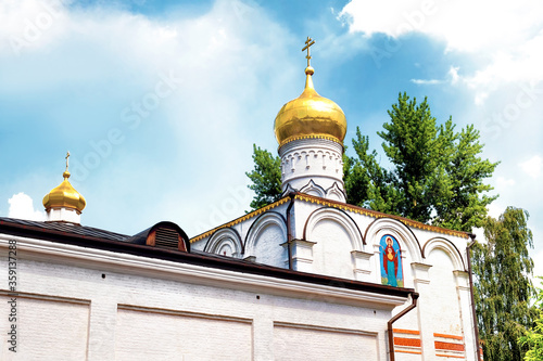 Photography orthodox church landmark in moscow city russia ancient russian architecture national heritage part of old Simonov convent against blue with clouds sky background