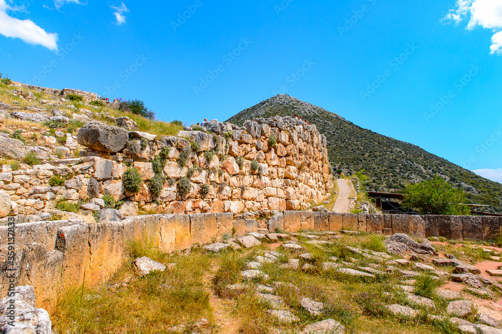 It's Walls of Mycenae, center of Greek civilization, Peloponnese, Greece. Mycenae is a famous archaeological site in Greece. UNESCO World Heritage Site