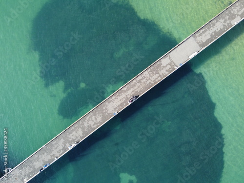 aerial view of pier and dock in the water photo