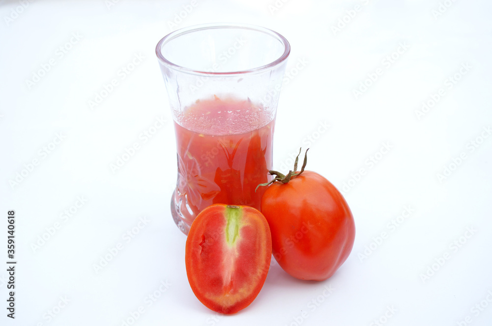 tomato juice in glass with fresh tometo isolated on white background tomato juice in glass with fresh tometo isolated on white background
