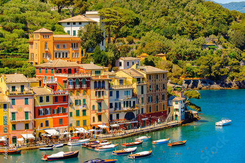 Fototapeta Naklejka Na Ścianę i Meble -  It's Close view of the colorful houses in Portofino, an Italian fishing village, Genoa province, Italy. A vacation resort with a picturesque harbour and with celebrity and artistic visitors.