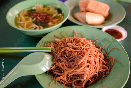 Photography Popular local breakfast delights in Singapore — fried bee hoon, noodle soup, and fried snacks