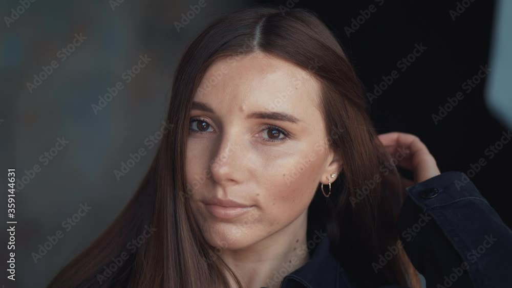 Face portrait of cute young woman with brown eyes and brown long hair Face portrait of cute young woman with brown eyes and brown long hair
