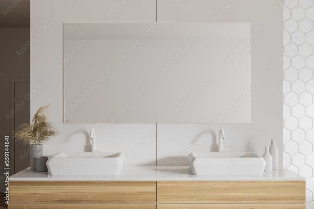 Double sink in white honeycomb tile bathroom Double sink in white honeycomb tile bathroom