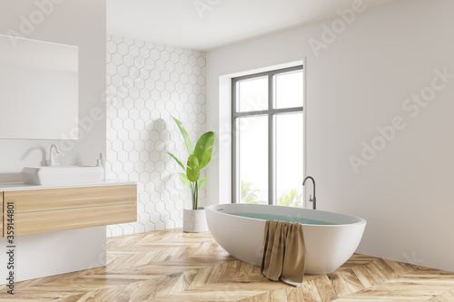White honeycomb tile bathroom  tub and sink