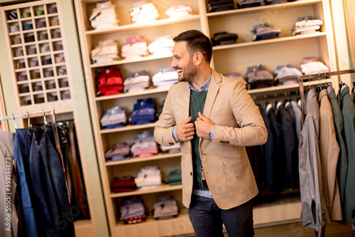 Handsome young man buying c...