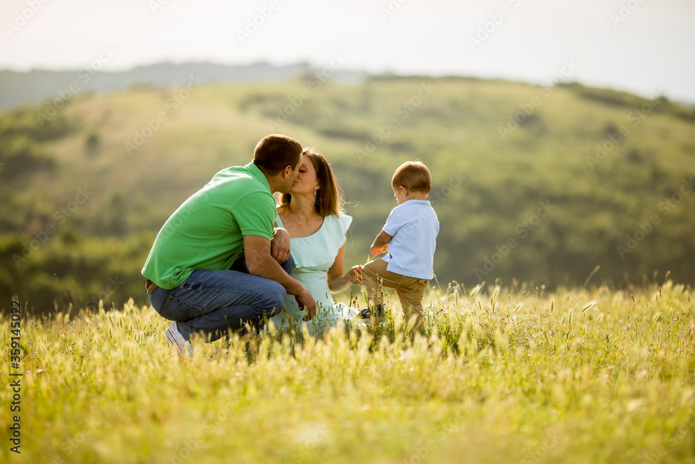 Young family having fun outdoors in the field Young family having fun outdoors in the field
