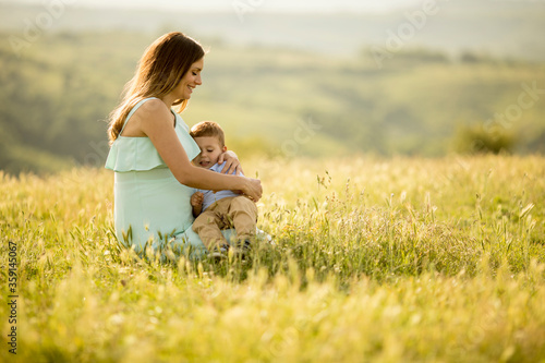 Young pregnant mother with ...