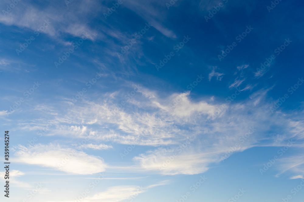 Blue evening sky with white clouds Blue evening sky with white clouds