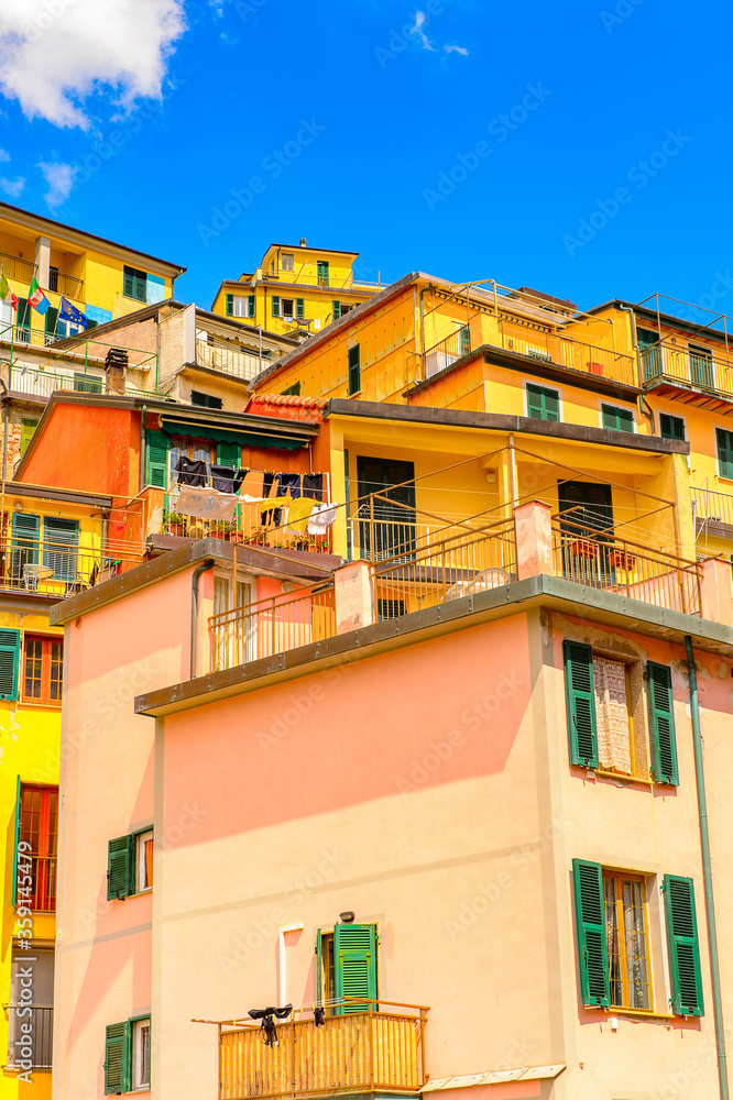 It's Houses of Riomaggiore (Rimazuu), a village in province of La Spezia, Liguria, Italy. It's one of the lands of Cinque Terre, UNESCO World Heritage Site