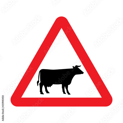 Cattle crossing warning road sign. Vector illustration of cow caution traffic sign. Farm hazzard attention red triangle mark.