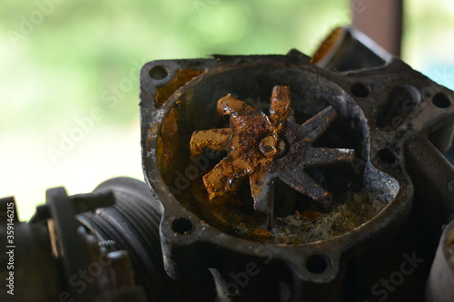 Worn out water pump dismounted from the vehicle engine cooling system