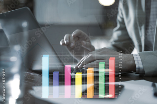 Forex trading. Man working with laptop in office and chart, closeup