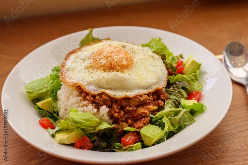 Taco rice, Japanese dish with meat, cheese and vegetables that originated in Okinawa.