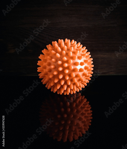 red ball representing coronavirus in reflection