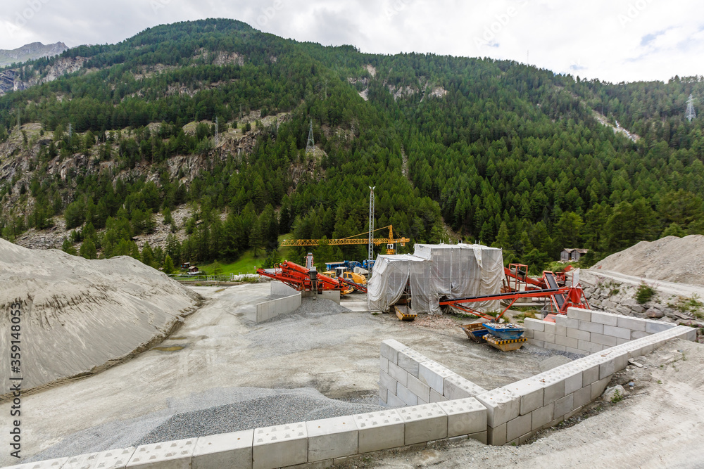 Foto de Constraction work up in the alps. Zermatt, Switzerland. Caterpillar equipment. do Stock