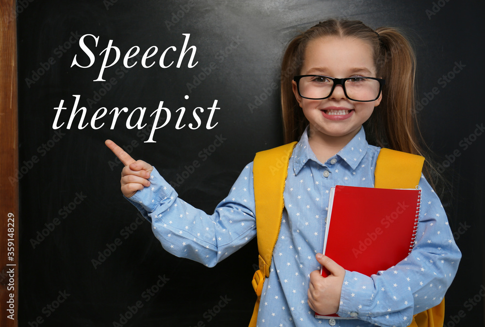 Cute little child near chalkboard and text Speech Therapist Cute little child near chalkboard and text Speech Therapist