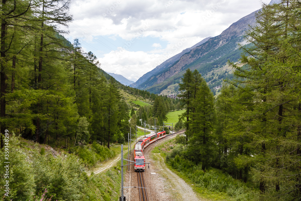 Fototapeta premium Zermatt, Switzerland - August 11, 2019 Swiss Railway Track Alps Train