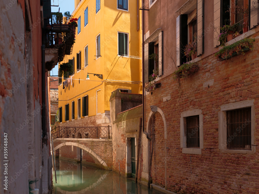 A yellow building on the Rio de San Zanirovo canal, Venice, Italy