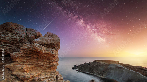 Clay Cliffs in Malta. Cliff on the background of the Milky Way. Landscape with Milky way galaxy. Sunset and and bright milky way galaxy. 