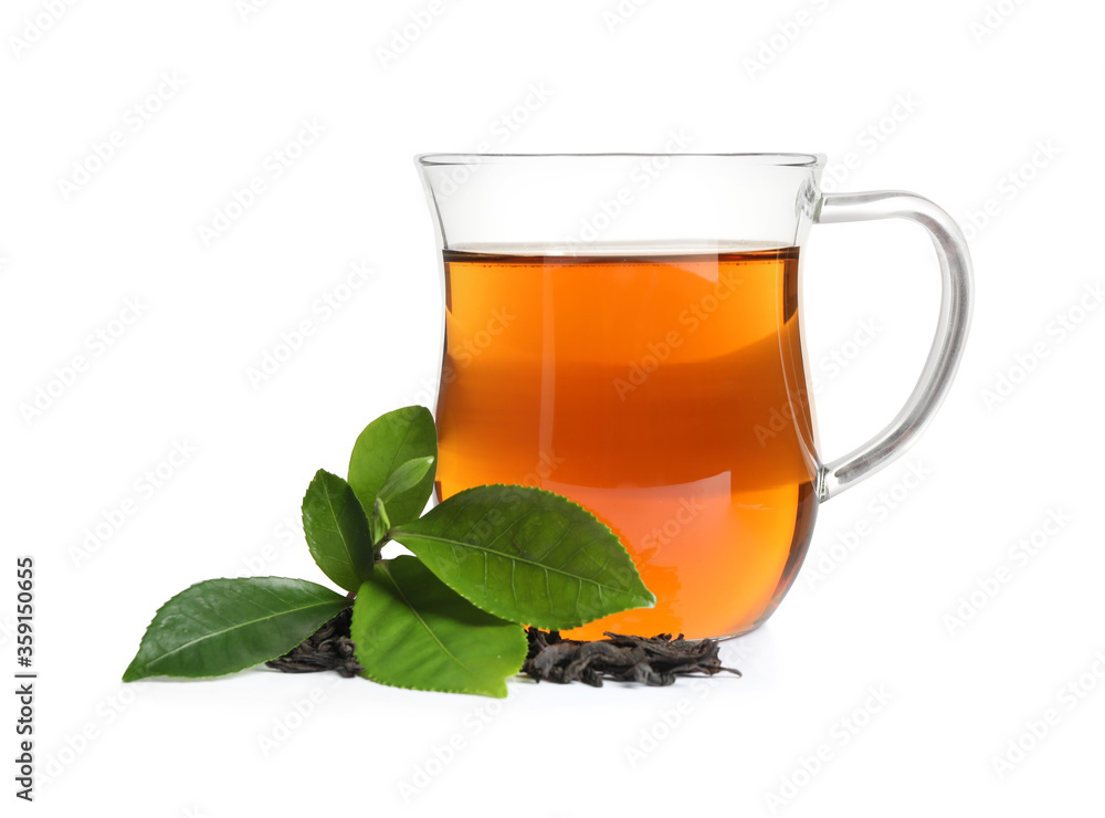 Tasty black tea with fresh and dry leaves on white background