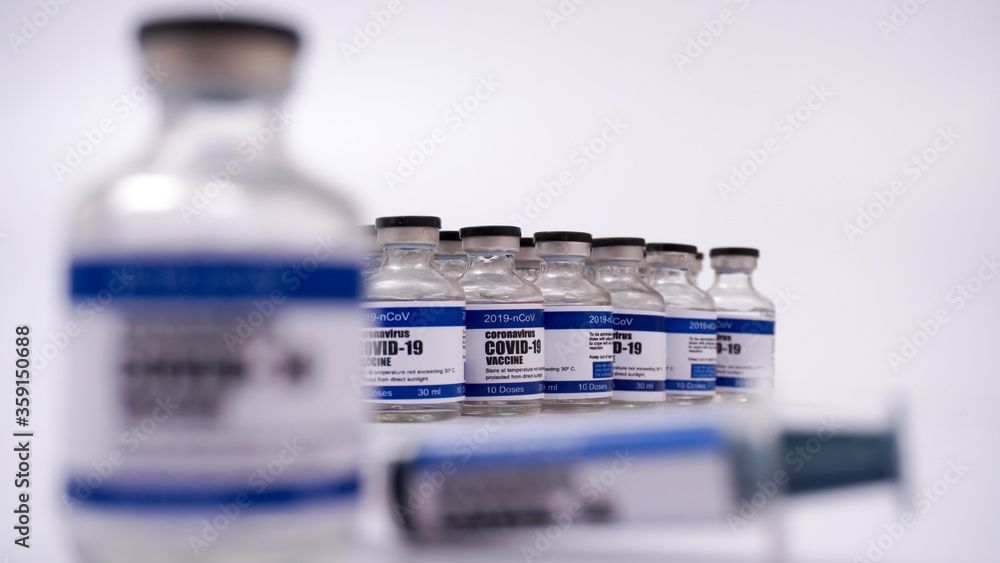 2019-ncov Covid-19 Corona Virus drug vaccine vials medicine bottles syringe injection. SARS-CoV-2 Vaccination, immunization, treatment to cure Covid 19 Corona Virus infection. Medical concept.