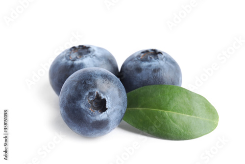 Fresh ripe blueberries with leaf on white background