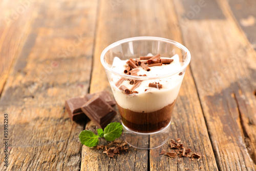 chocolate mousse and cream on wood background