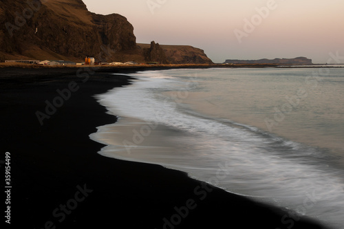 Black sand beach at sunset